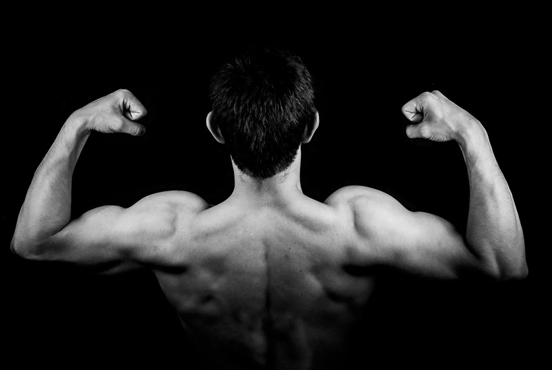 photo of man showing back muscles: membership webpage